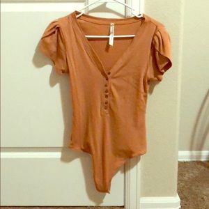 Orangish body suit
